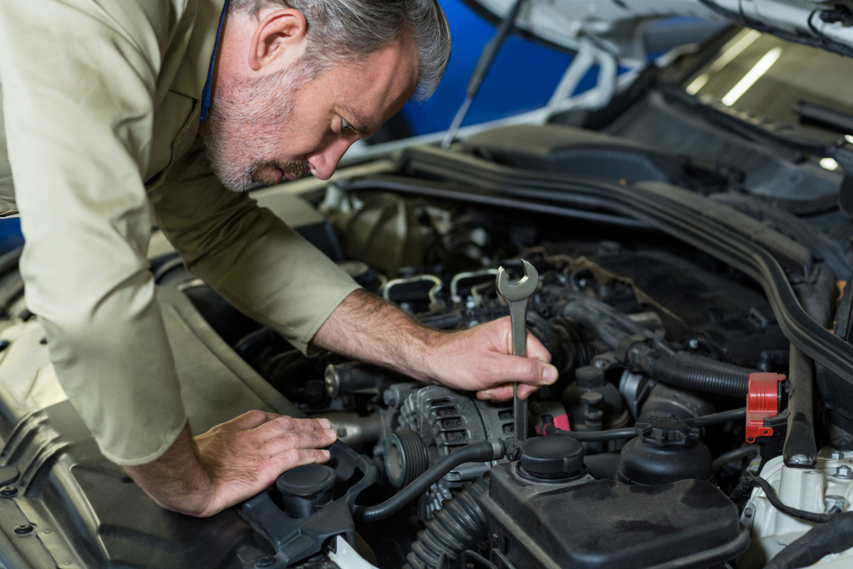Technician repairing car radiator in Melbourne workshop